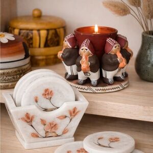Vintage Peruvian terracotta handcrafted candle holder featuring musician